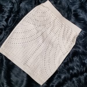 Silver studded white mini skirt